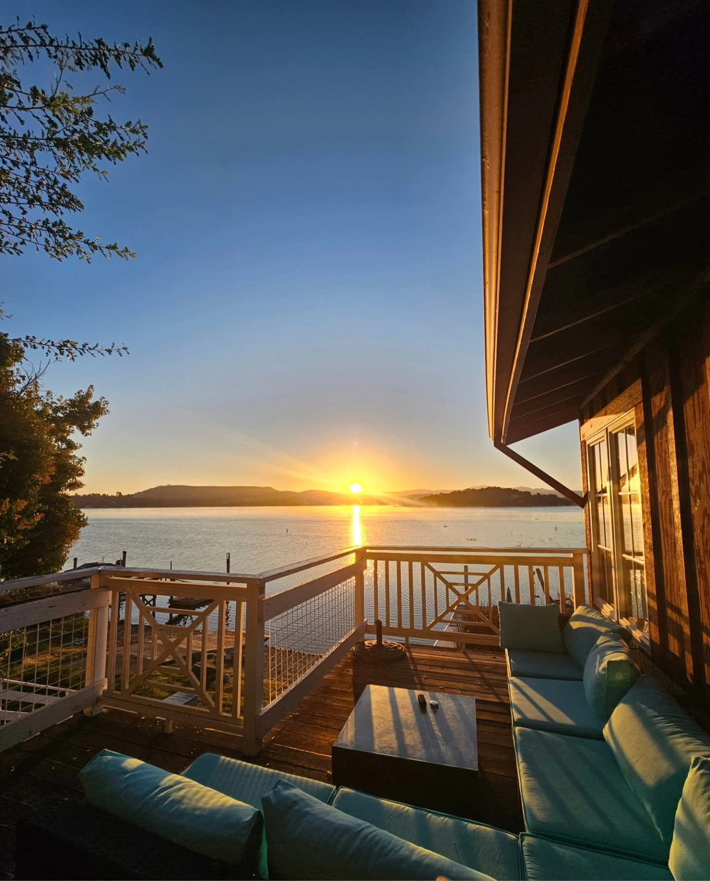 Golden-hour view of Clear Lake from the lodge deck