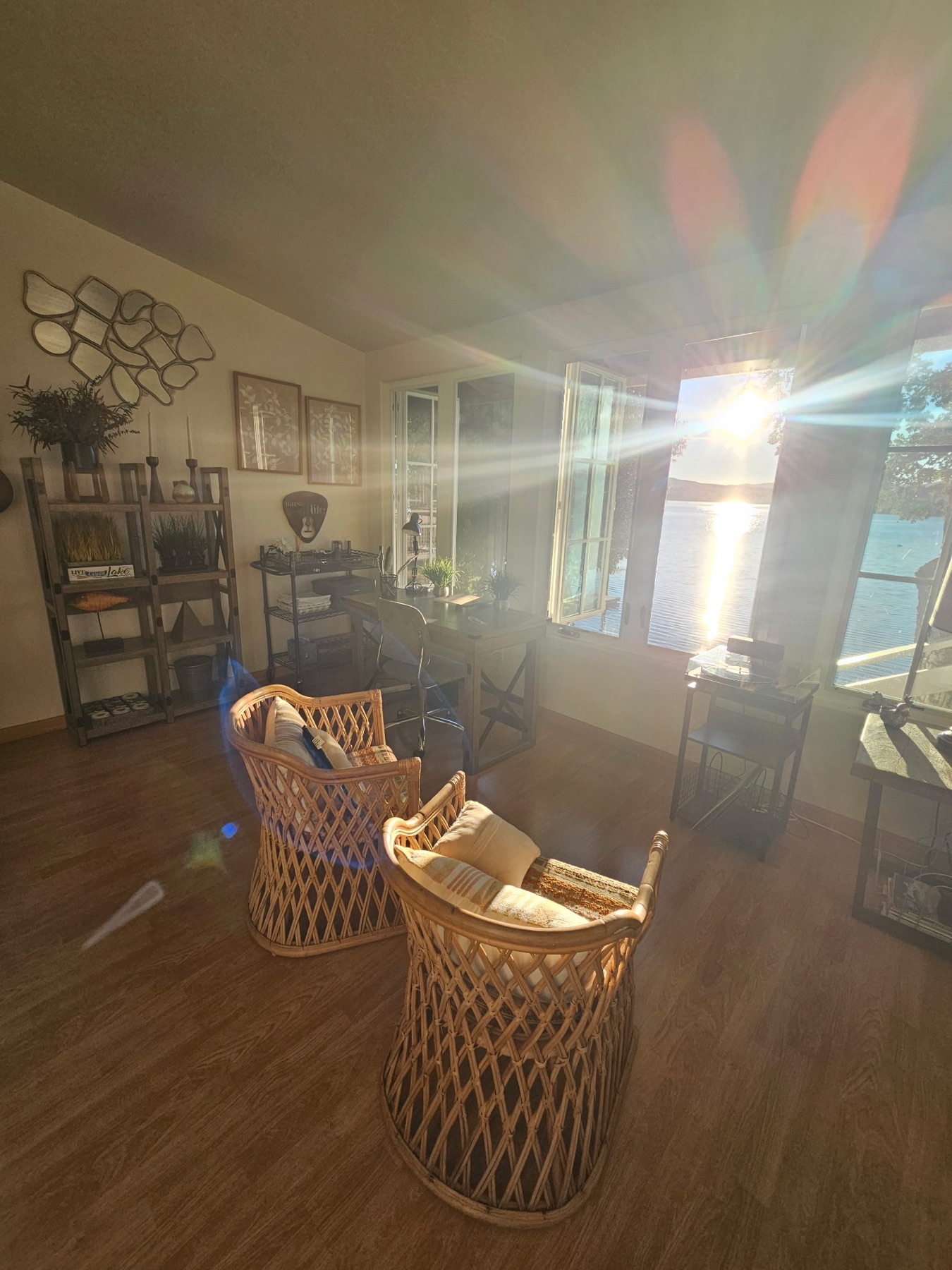 Sunlit lake-facing lounge at Sunrise Cove Lodge