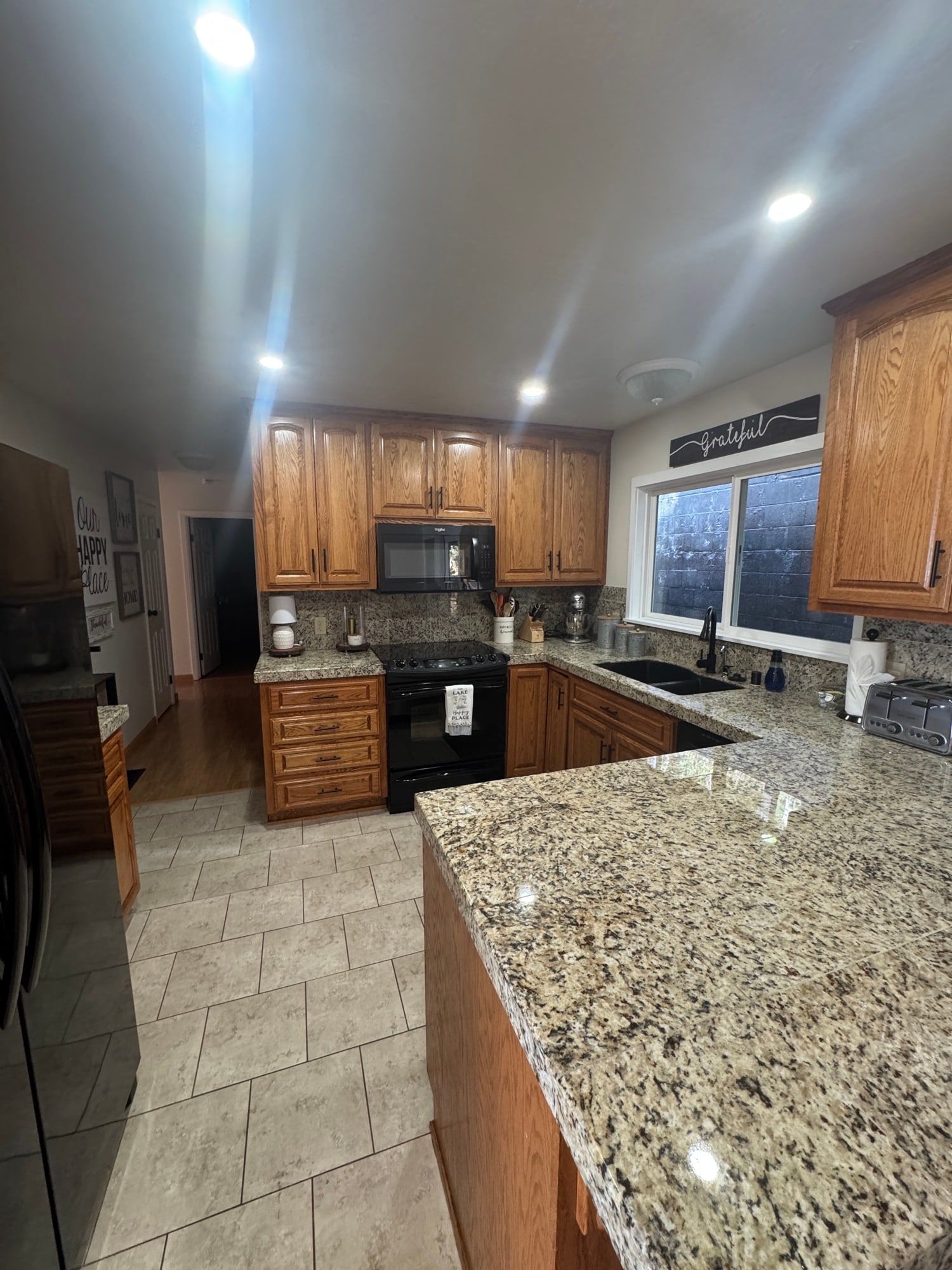 Kitchen workspace with electric range and lake-side light