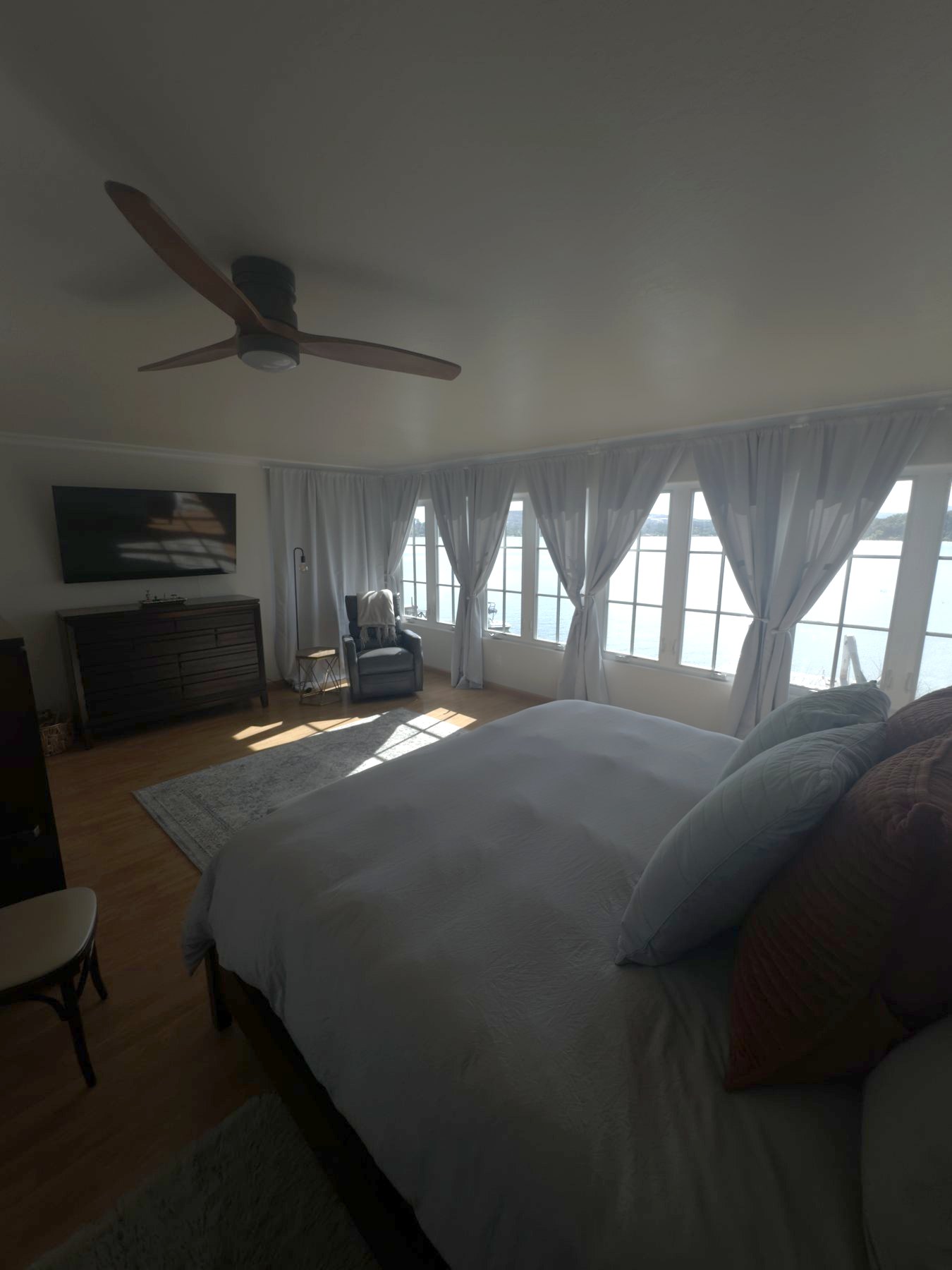 Primary bedroom facing the lake windows